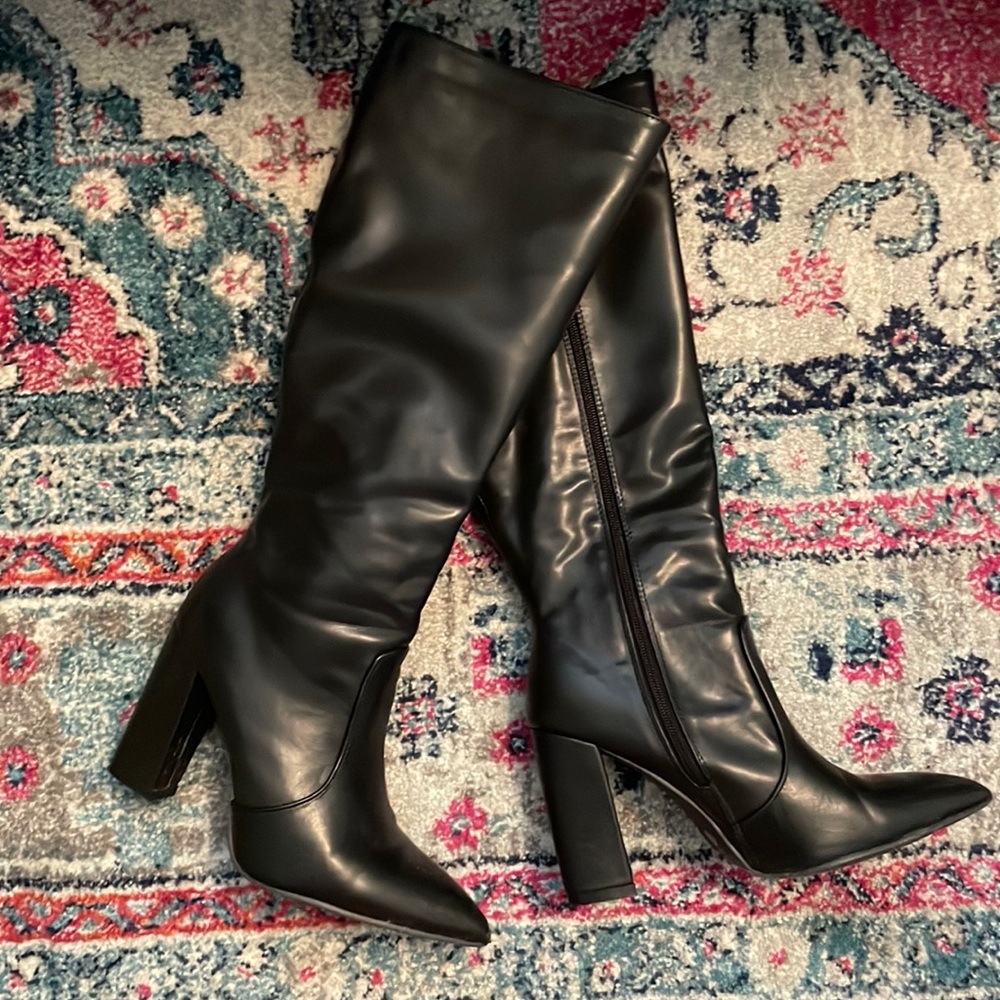 Black pointed toe knee-high boots